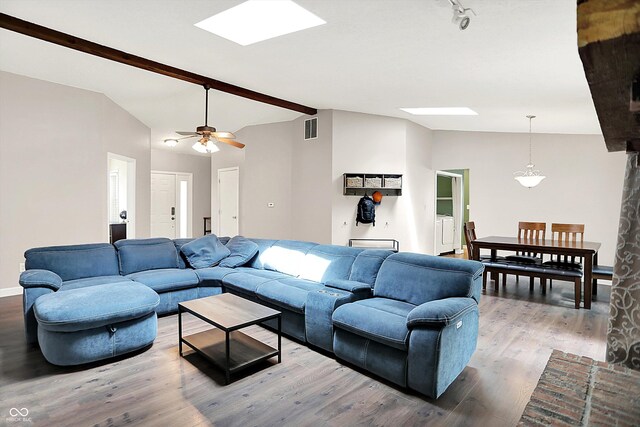 1697 Stacy Lynn Dr, Indianapolis, IN 46231 - living area with a skylight, wood finished floors, ceiling fan, and baseboards