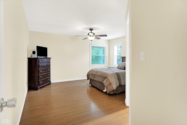 1697 Stacy Lynn Dr, Indianapolis, IN 46231 - bedroom with wood finished floors, baseboards, and ceiling fan