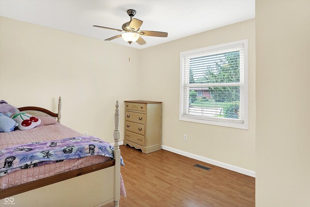 1697 Stacy Lynn Dr, Indianapolis, IN 46231 - bedroom with light wood-style flooring, baseboards, and ceiling fan