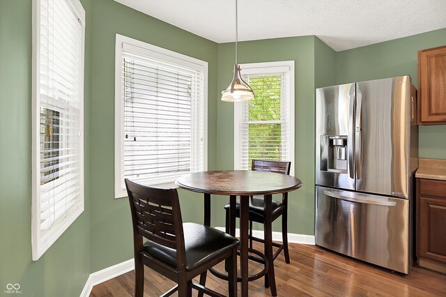 1697 Stacy Lynn Dr, Indianapolis, IN 46231 - dining area featuring dark wood finished floors and baseboards