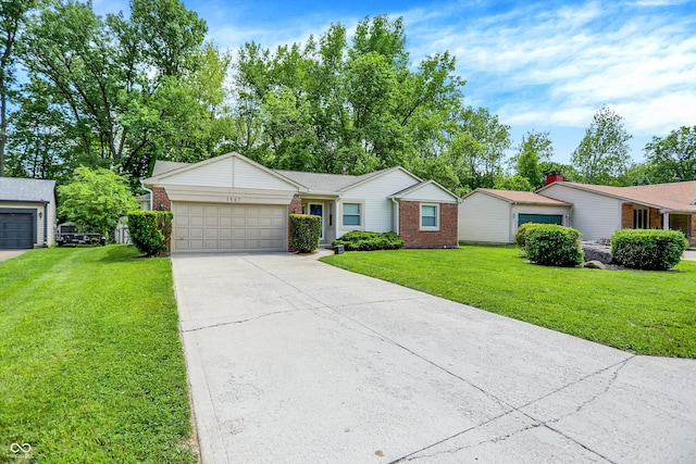 1697 Stacy Lynn Dr, Indianapolis, IN 46231 - ranch-style house with brick siding, a garage, a front yard, and driveway