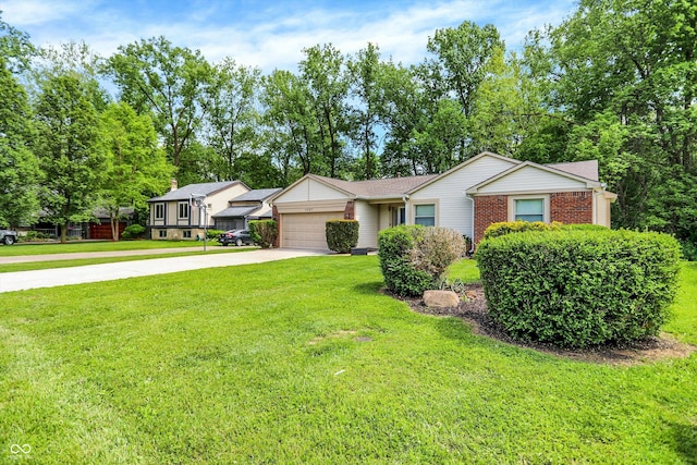 1697 Stacy Lynn Dr, Indianapolis, IN 46231 - view of front of house featuring a garage, concrete driveway, a front yard, and brick siding