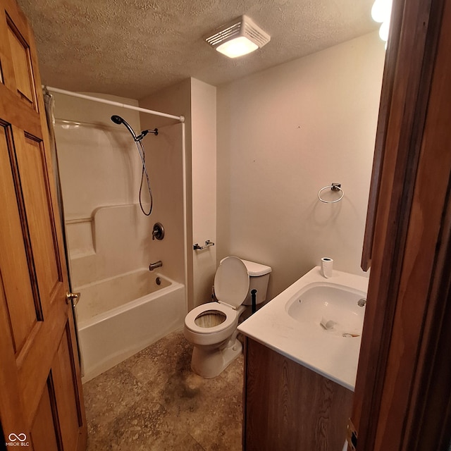 full bath featuring vanity, a textured ceiling, toilet, and shower / bathtub combination