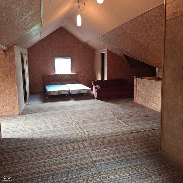 additional living space with carpet flooring and vaulted ceiling