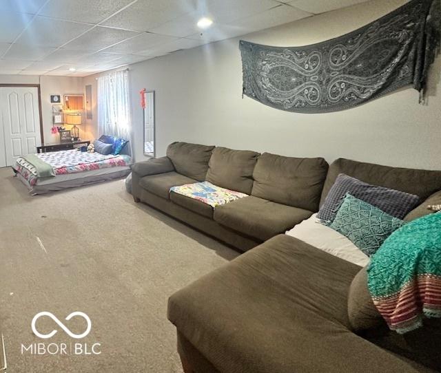 6036 Chinkapin Dr, Columbus, IN 47201 - living room featuring carpet and a drop ceiling
