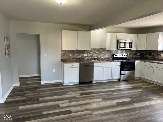 103 N Nebraska St, North Salem, IN 46165 - kitchen with backsplash, white cabinets, stainless steel appliances, and a sink