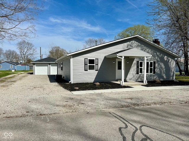 103 N Nebraska St, North Salem, IN 46165 - bungalow featuring a garage and a chimney