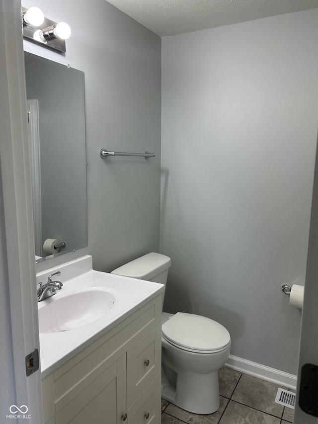 103 N Nebraska St, North Salem, IN 46165 - bathroom featuring tile patterned flooring, visible vents, toilet, and vanity
