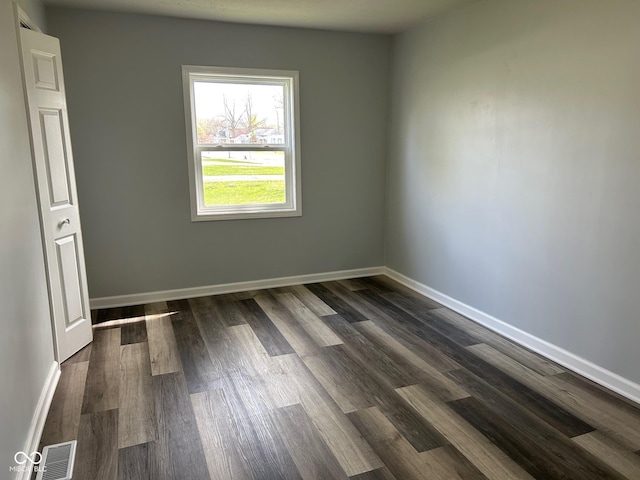 103 N Nebraska St, North Salem, IN 46165 - empty room featuring baseboards, dark wood-type flooring, and visible vents