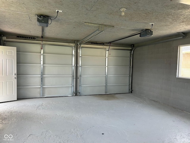 103 N Nebraska St, North Salem, IN 46165 - garage with concrete block wall and a garage door opener