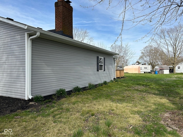 103 N Nebraska St, North Salem, IN 46165 - view of side of property with a lawn and a chimney