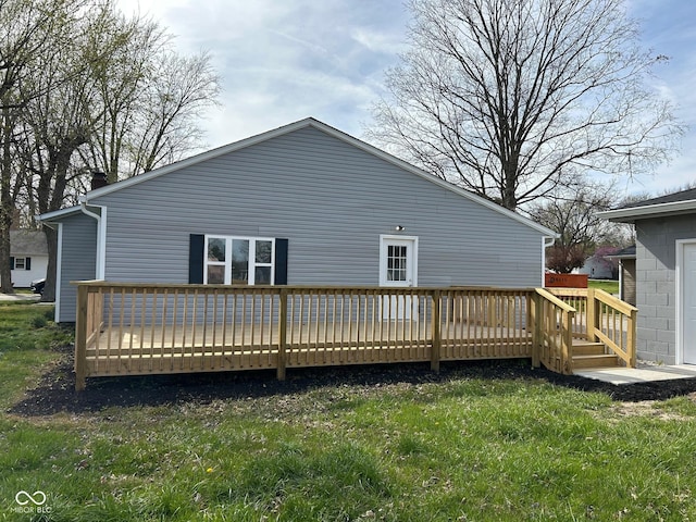 103 N Nebraska St, North Salem, IN 46165 - rear view of house featuring a wooden deck and a lawn