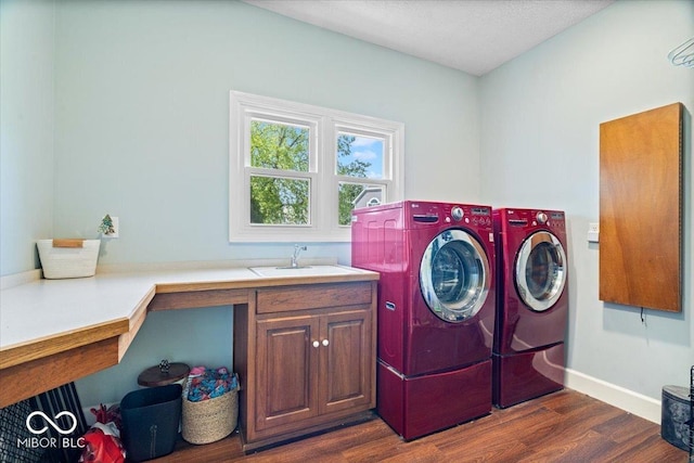 244 W Admiral Way S, Carmel, IN 46032 - washroom with washing machine and dryer, dark wood-style floors, cabinet space, and baseboards