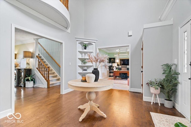 244 W Admiral Way S, Carmel, IN 46032 - entrance foyer featuring stairway, a towering ceiling, wood finished floors, ornamental molding, and baseboards