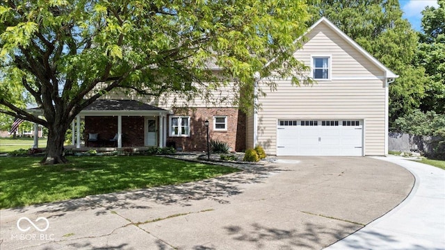 244 W Admiral Way S, Carmel, IN 46032 - view of front of property featuring concrete driveway, an attached garage, a front lawn, and brick siding