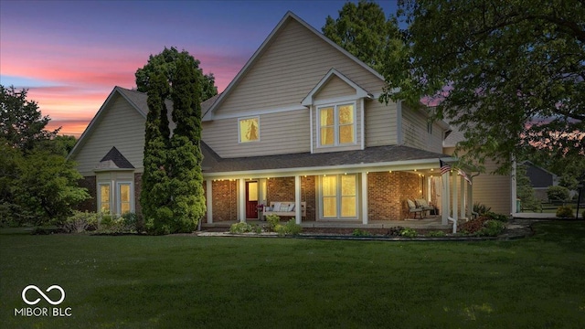 244 W Admiral Way S, Carmel, IN 46032 - traditional-style home with a porch, a yard, and brick siding
