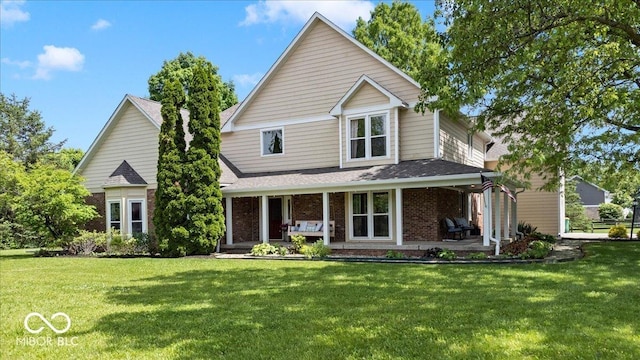 244 W Admiral Way S, Carmel, IN 46032 - traditional-style house with a front lawn, brick siding, covered porch, and roof with shingles