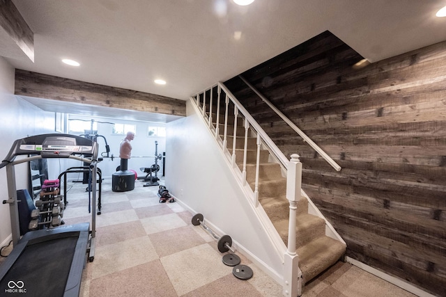 interior space with recessed lighting, tile patterned floors, wood walls, and baseboards
