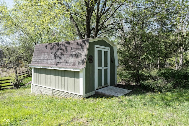 view of shed with fence