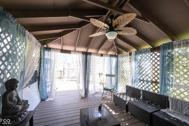 exterior space featuring ceiling fan and beamed ceiling