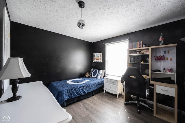 bedroom with wood finished floors