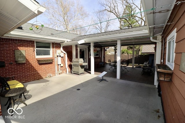 view of patio featuring fence