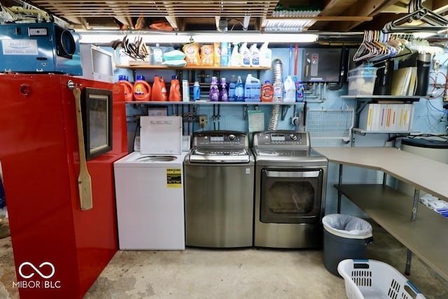 laundry room featuring independent washer and dryer and laundry area