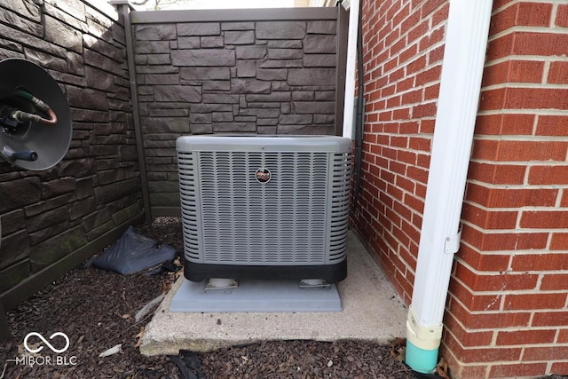 details featuring brick siding and central AC