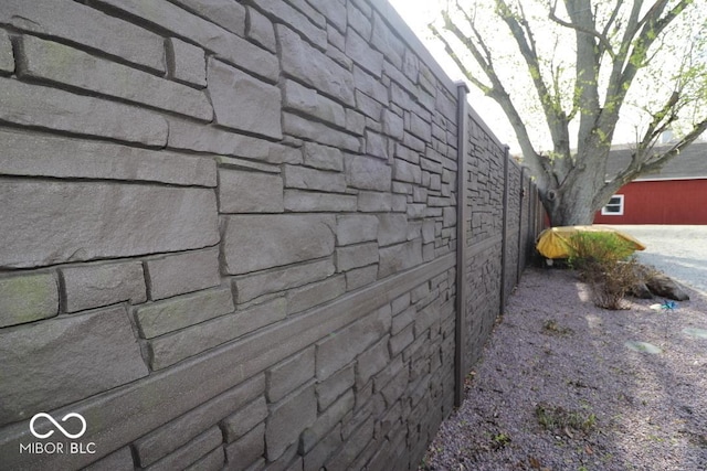 view of side of home with fence