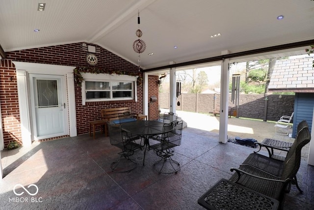 view of patio with fence and outdoor dining space