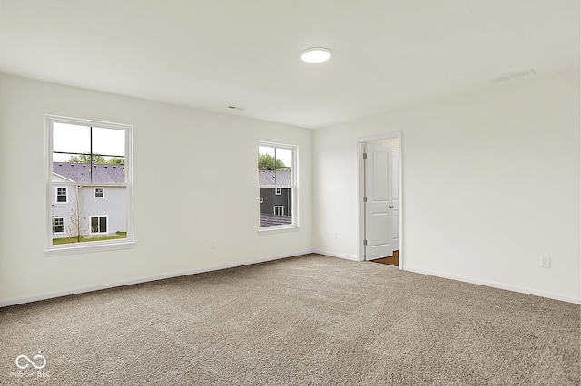 2764 Glade Ave, Plainfield, IN 46168 - spare room featuring carpet floors, healthy amount of natural light, and baseboards