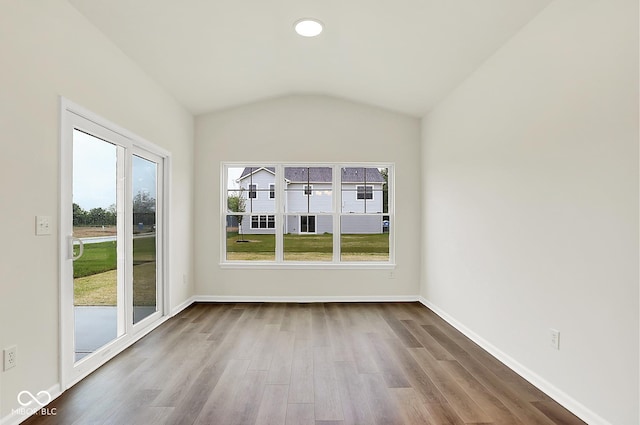 2764 Glade Ave, Plainfield, IN 46168 - empty room featuring vaulted ceiling, wood finished floors, and baseboards