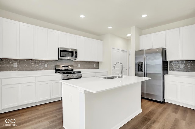 2764 Glade Ave, Plainfield, IN 46168 - kitchen with appliances with stainless steel finishes, a sink, decorative backsplash, wood finished floors, and recessed lighting