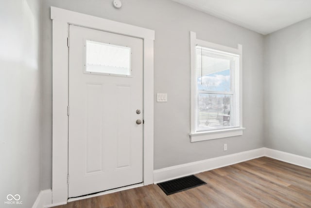 2114 N Dexter St, Indianapolis, IN 46202 - foyer entrance with baseboards, wood finished floors, and visible vents