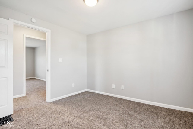 2114 N Dexter St, Indianapolis, IN 46202 - carpeted empty room with baseboards