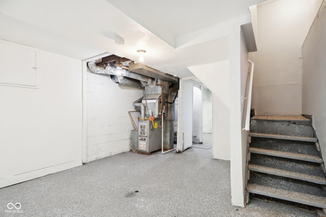 2114 N Dexter St, Indianapolis, IN 46202 - basement featuring concrete block wall, stairway, and heating unit