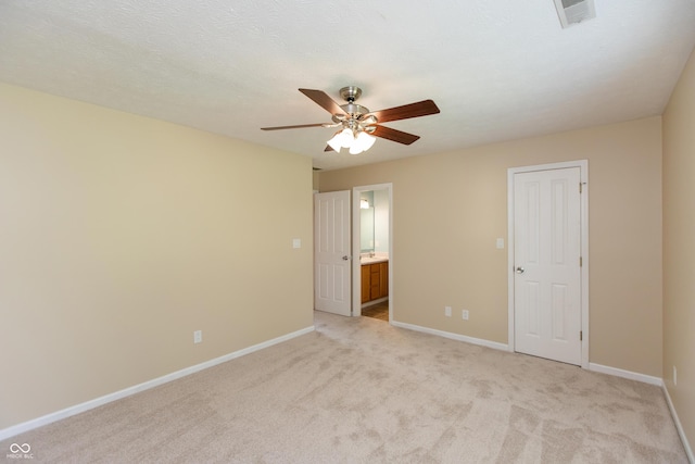 1579 Winding Creek Trl, Brownsburg, IN 46112 - unfurnished bedroom with light colored carpet, ensuite bathroom, and ceiling fan