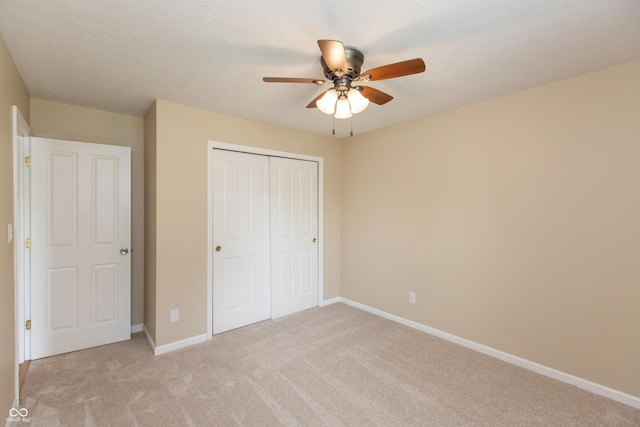1579 Winding Creek Trl, Brownsburg, IN 46112 - unfurnished bedroom with light colored carpet, a closet, and a ceiling fan