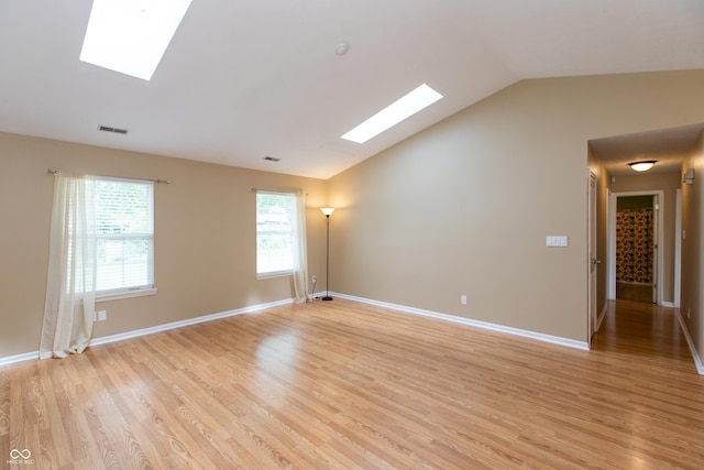 1579 Winding Creek Trl, Brownsburg, IN 46112 - unfurnished room featuring a skylight, vaulted ceiling, and light wood finished floors