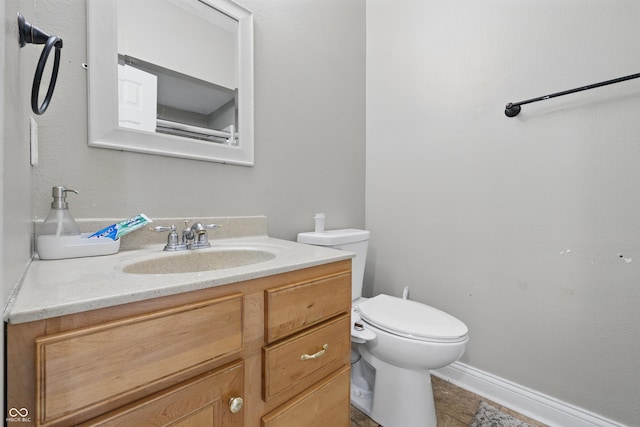 621 Fireside Dr, Greenwood, IN 46143 - bathroom featuring vanity, toilet, and tile patterned flooring