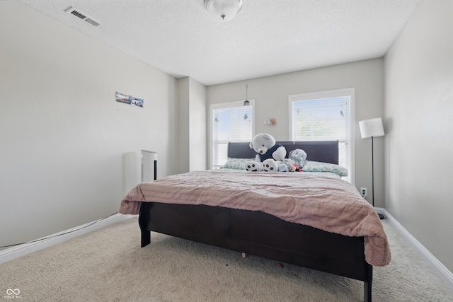 621 Fireside Dr, Greenwood, IN 46143 - carpeted bedroom with a textured ceiling and baseboards