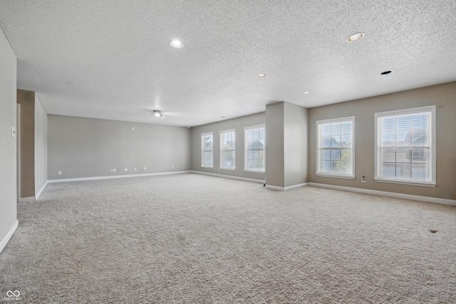 621 Fireside Dr, Greenwood, IN 46143 - carpeted empty room featuring a textured ceiling, baseboards, and recessed lighting