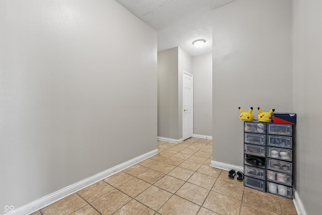 621 Fireside Dr, Greenwood, IN 46143 - empty room featuring light tile patterned floors, baseboards, and a textured ceiling