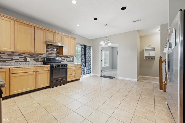 621 Fireside Dr, Greenwood, IN 46143 - kitchen featuring black gas range oven, freestanding refrigerator, under cabinet range hood, backsplash, and light brown cabinets
