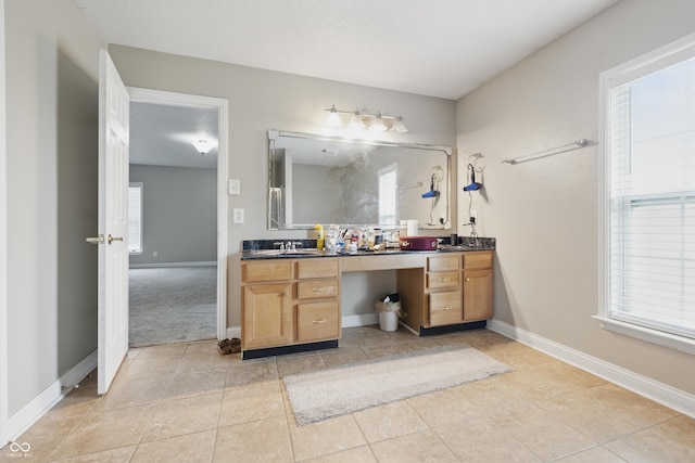 621 Fireside Dr, Greenwood, IN 46143 - full bathroom with double vanity, tile patterned floors, and baseboards