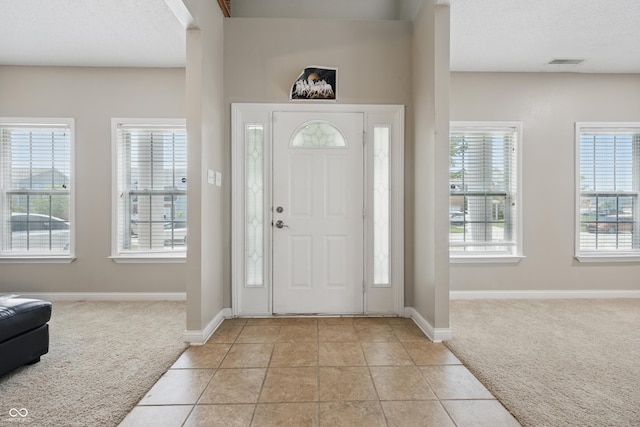 621 Fireside Dr, Greenwood, IN 46143 - foyer entrance with light colored carpet and baseboards