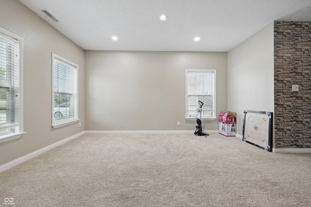 621 Fireside Dr, Greenwood, IN 46143 - spare room featuring carpet flooring, healthy amount of natural light, baseboards, and recessed lighting