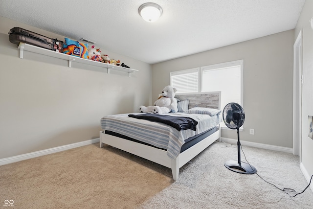 621 Fireside Dr, Greenwood, IN 46143 - bedroom with carpet flooring, baseboards, and a textured ceiling