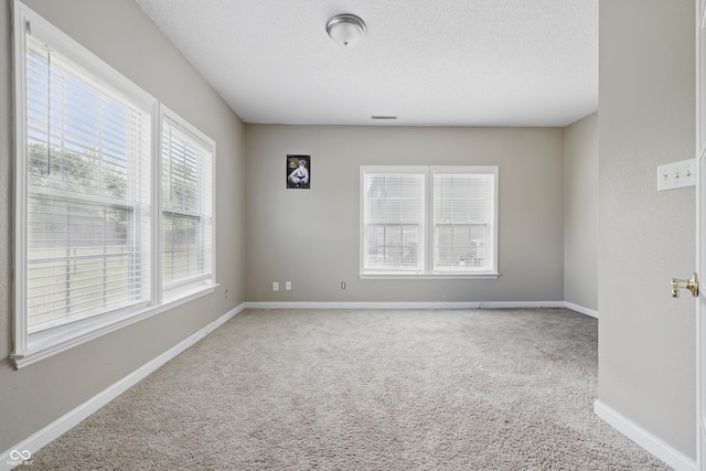 621 Fireside Dr, Greenwood, IN 46143 - unfurnished room with carpet, baseboards, and a textured ceiling