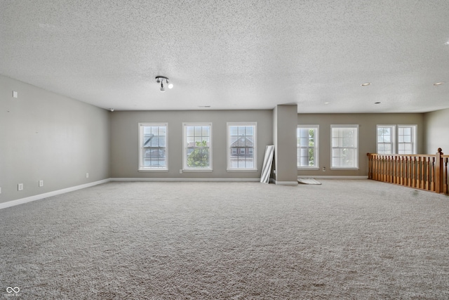 621 Fireside Dr, Greenwood, IN 46143 - carpeted empty room featuring a textured ceiling and baseboards